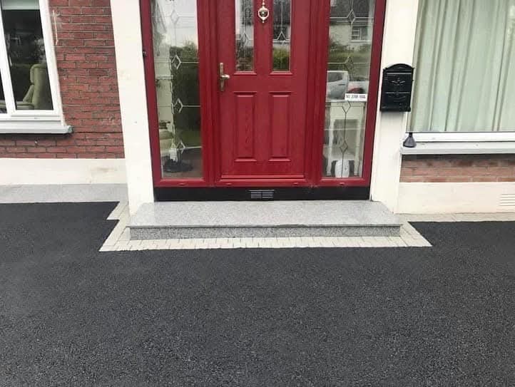 Granite doorstep with neat block paving border
