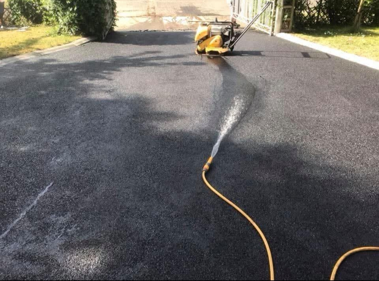 Tarmac driveway being finished and washed down